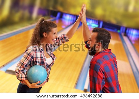 Picture showing friends playing bowling