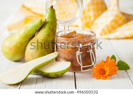 jam from a pear in a jar on a table, selective focus