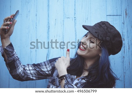 hipster girl getting a selfie with finger ok