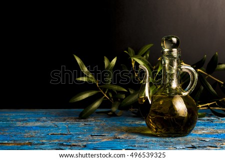 Extra virgin olive oil vintage cruet on dark background