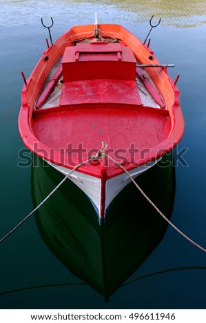 Red wooden boat.