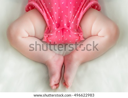 chubby baby legs with pleats Royalty-Free Stock Photo #496622983