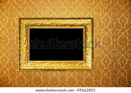 Vintage frame over golden wallpaper