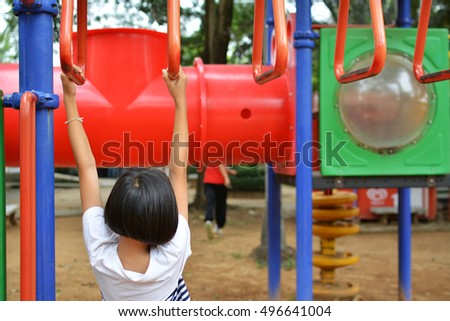 Little girl playing in park. Selective of focus