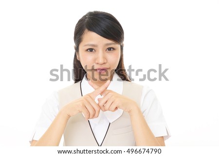 Businesswoman demonstrating prohibiting gesture