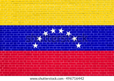 Venezuelan national official flag. Bolivarian Republic of Venezuela patriotic symbol, banner, element, background. Flag of Venezuela on brick wall texture background