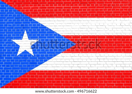 Puerto Rican national official flag. Patriotic symbol, banner, element, background. Flag of Puerto Rico on brick wall texture background