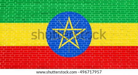 Ethiopian national official flag. African patriotic symbol, banner, element, background. Flag of Ethiopia on brick wall texture background