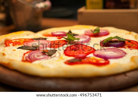 Served pizza on the plate, hot and delicious pizza