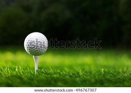 Golf ball on tee ready to be shot Royalty-Free Stock Photo #496767307