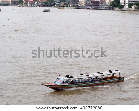 Water way CHAO PHRAYA river boat ship goods & person Transportation, BANGKOK, THAILAND. Authentic tourist attraction business life scene, picture taken from above on bridge walkway on October 8, 2016
