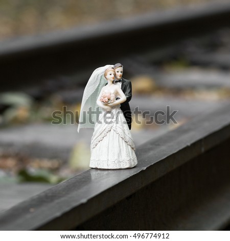 Little wedding cake topper with groom and bride