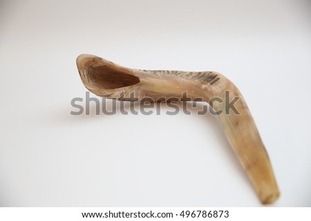 shofar (ram horn) isolated over white background
Jewish New Year. Shofar, or ram's horn, for the Jewish holiday of Rosh Hashana; isolated on a white background

