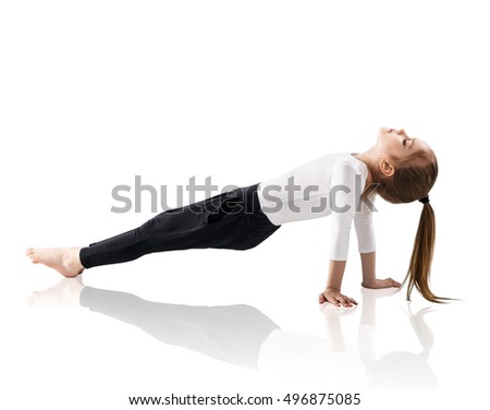 Little girl doing yoga exercises