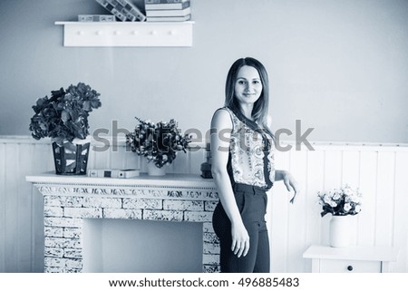Young woman posing in the room