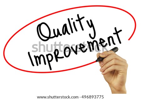 Man Hand writing Quality Improvement with black marker on visual screen. Isolated on background. Business, technology, internet concept. Stock Photo
