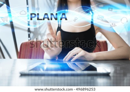Woman is using tablet pc, pressing on virtual screen and selecting plan a