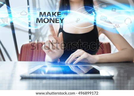 Woman is using tablet pc, pressing on virtual screen and selecting make money
