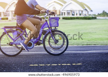 Woman riding a bicycle. selective focus image