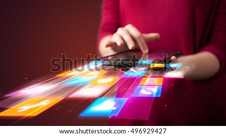 Hand holding tablet device with media application concept on background