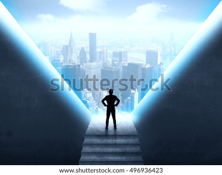 Businessman standing in the prison and looking at the cityscape