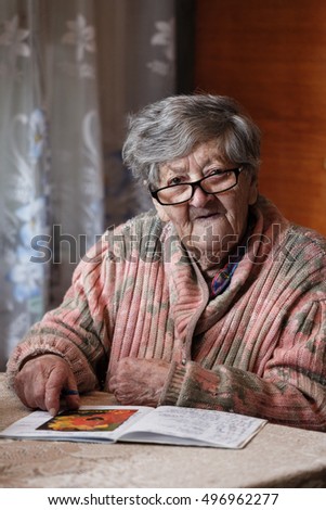 grandma at the table with glasses