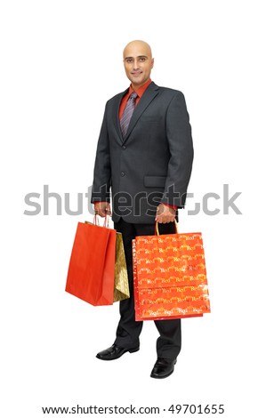 Elegant businessman with shopping bags isolated in white