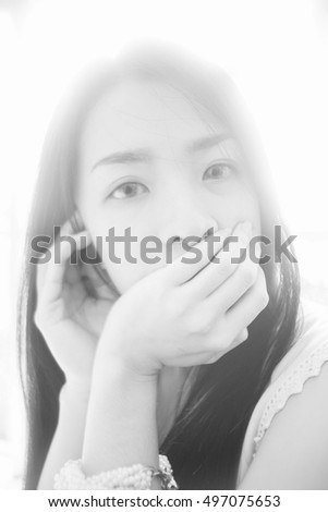 portrait of young asian woman looked at camera,high key picture style,black and white color picture,soft focus
