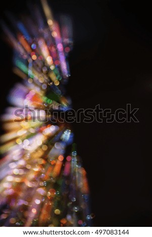 Abstract Christmas tree : blurred motion bokeh multicolored lights                           