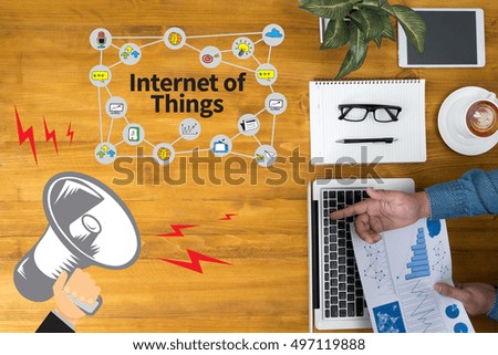 Internet of Things Businessman working at office desk and using computer and objects, coffee, top view