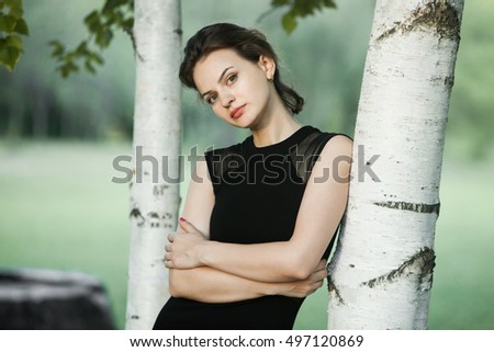 Portrait of attractive young girl on a sunny summer day. 