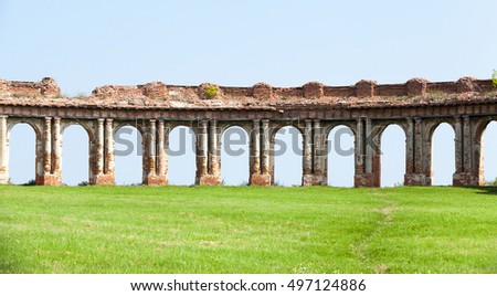   the ruins picture ancient fortress of the 16th century, situated in the village of Ruzhany Grodno region, Belarus, ruined arch against a blue sky