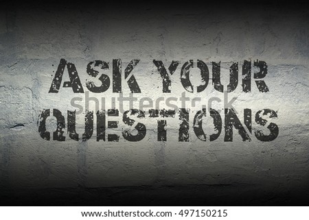 ask your questions stencil print on the grunge white brick wall; specially designed font is used