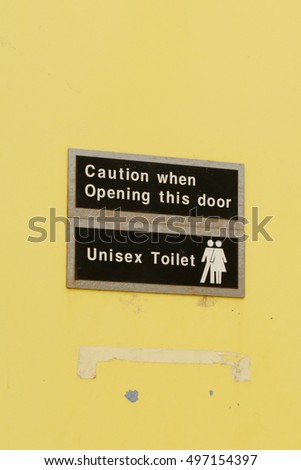 Unisex Toilet sign on door