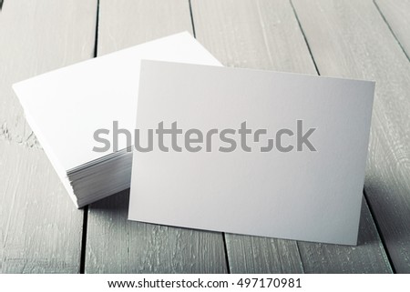 blank business cards on a wooden background