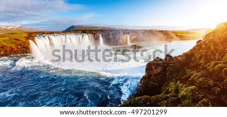 Nice views of the bright sunlit powerful Godafoss cascade. Popular tourist attraction. Unusual and picturesque scene. Location Bardardalur valley, Skjalfandafljot river, Iceland, Europe. Beauty world.