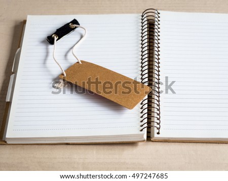 blank tag paper on note book paper for your text.