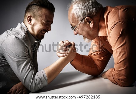 Two men arm wrestling competition.