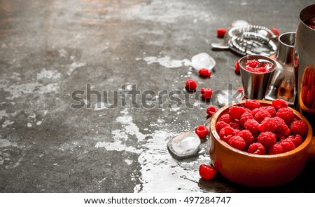 fresh cocktail of wild raspberries with ice. On the stone table.