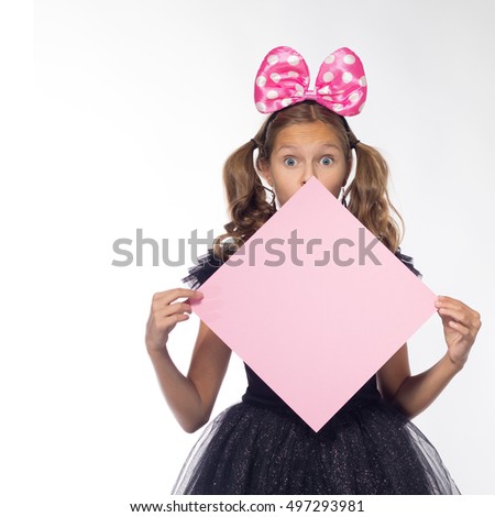 emotional girl actress cheerful blonde in a black dress with a pink sheet of paper for notes on a white background