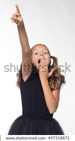 emotional girl actress cheerful blonde in black dress on a white background