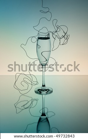 Champagne Glass on mirror surface with wire in soft colors