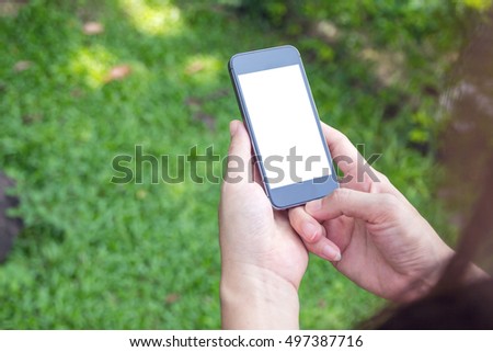 shot view of a woman's hands holding mobile phone.