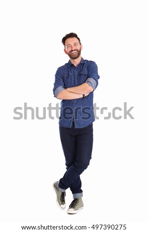 Full body portrait of relaxed mature man standing with arms crossed over white background
