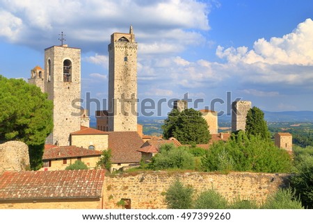 Sunny towers of medieval buildings in San Gimignano, region of Tuscany, Italy