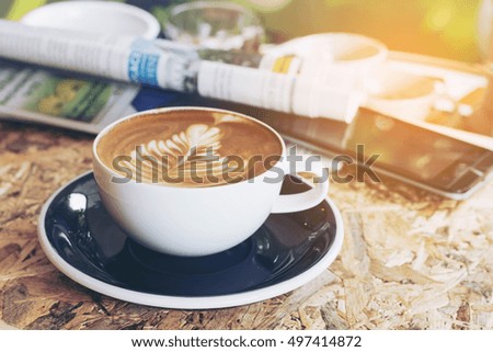 Good morning with lovely warm sun shine with coffee and newspaper 