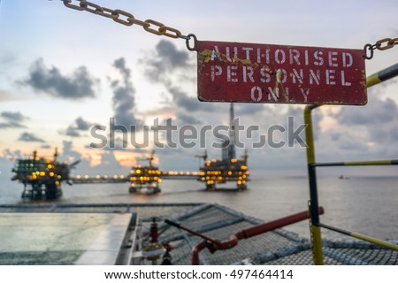 A signage "Authorised Personnel Only" on the helideck of at construction barge at oilfield Malaysia