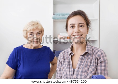 Happy daughter and mother portrait at home