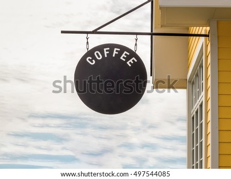 coffee sign shop storefront bright yellow