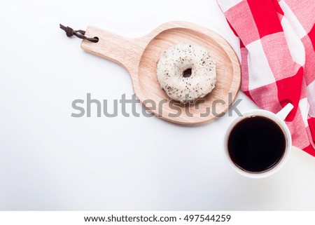 Donut and coffee on table. Top view with copy space